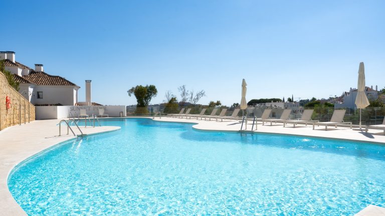 Communal swimming pool at 9 Lions Residences in Nueva Andalucía, Marbella