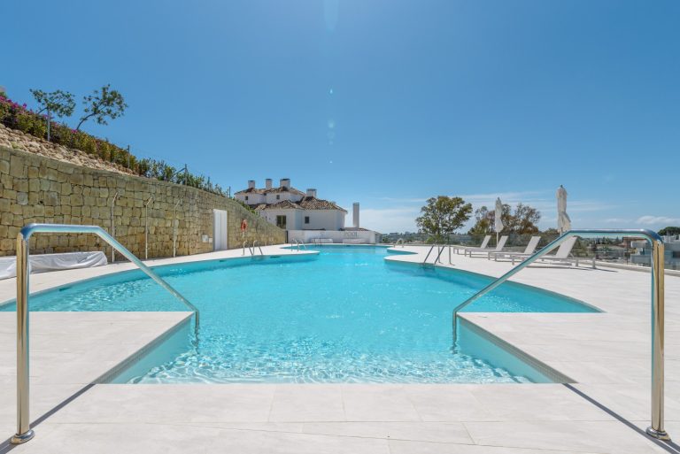 Communal swimming pool at 9 Lions Residences in Nueva Andalucía, Marbella